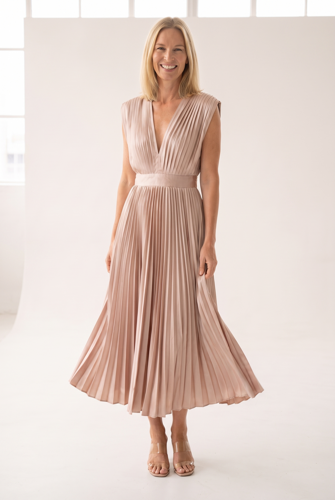 Woman wearing pleated satin midi dress