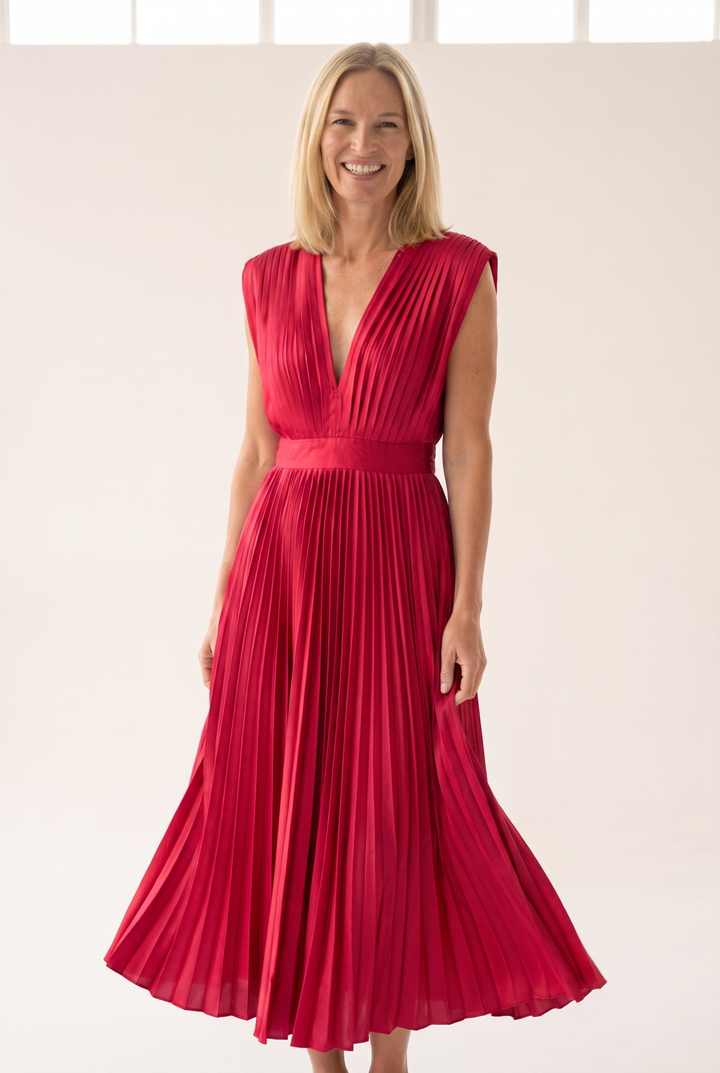 Woman wearing pleated satin midi dress
