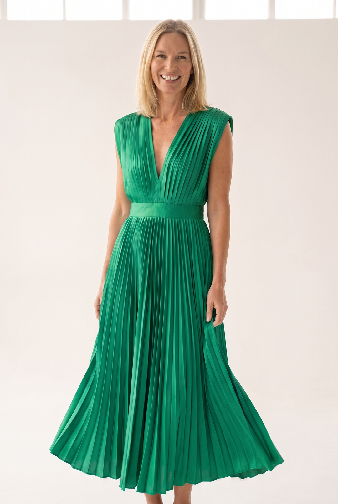 Woman wearing pleated satin midi dress