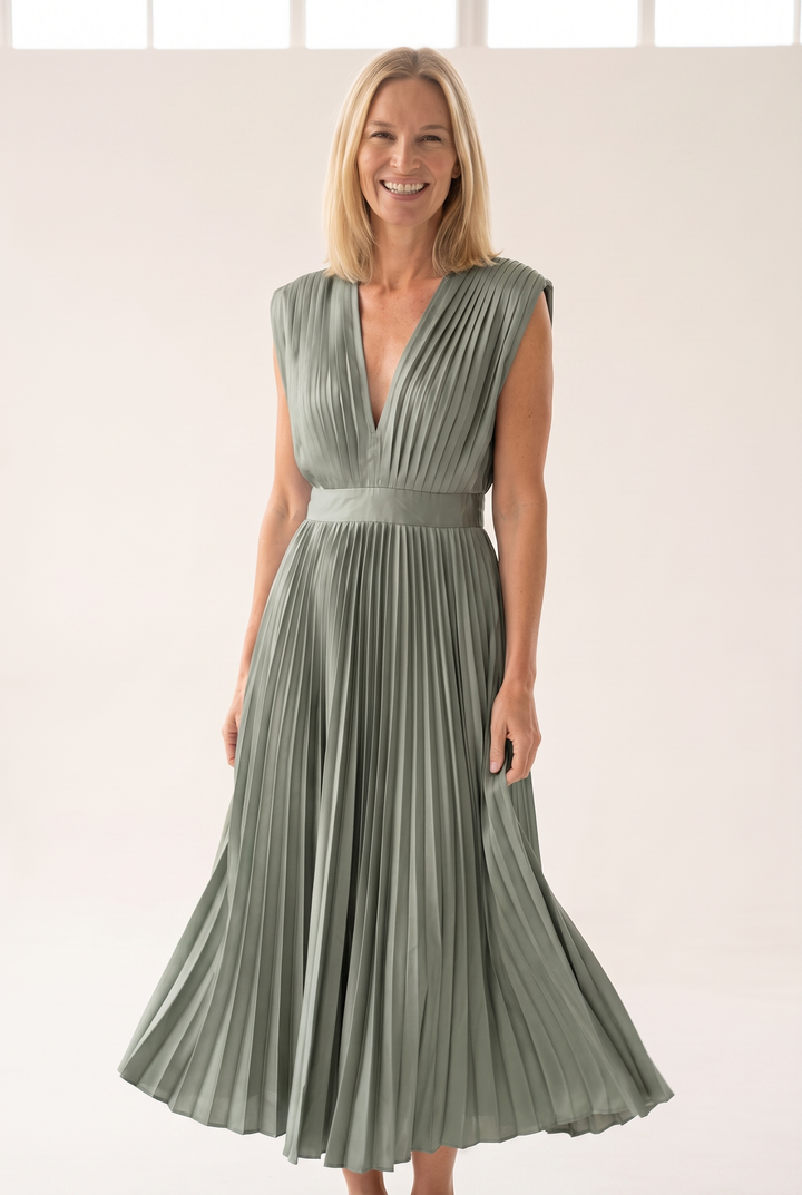 Woman wearing pleated satin midi dress