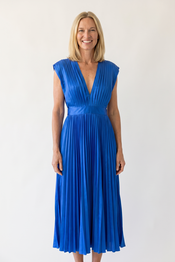 Woman wearing pleated satin midi dress