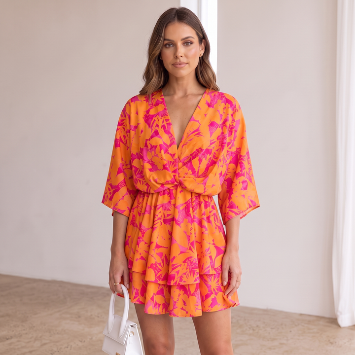 Woman wearing vibrant ruffle mini dress