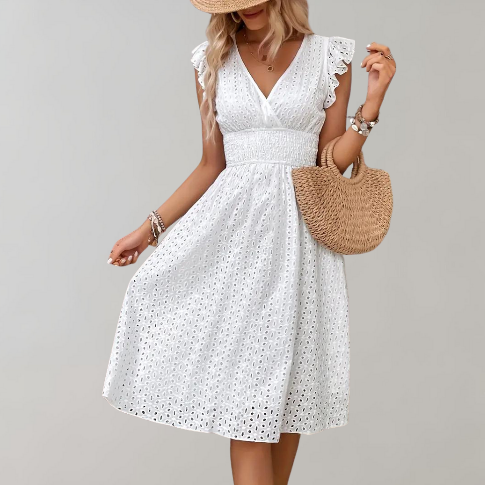 Woman wearing broderie v-neck summer dress
