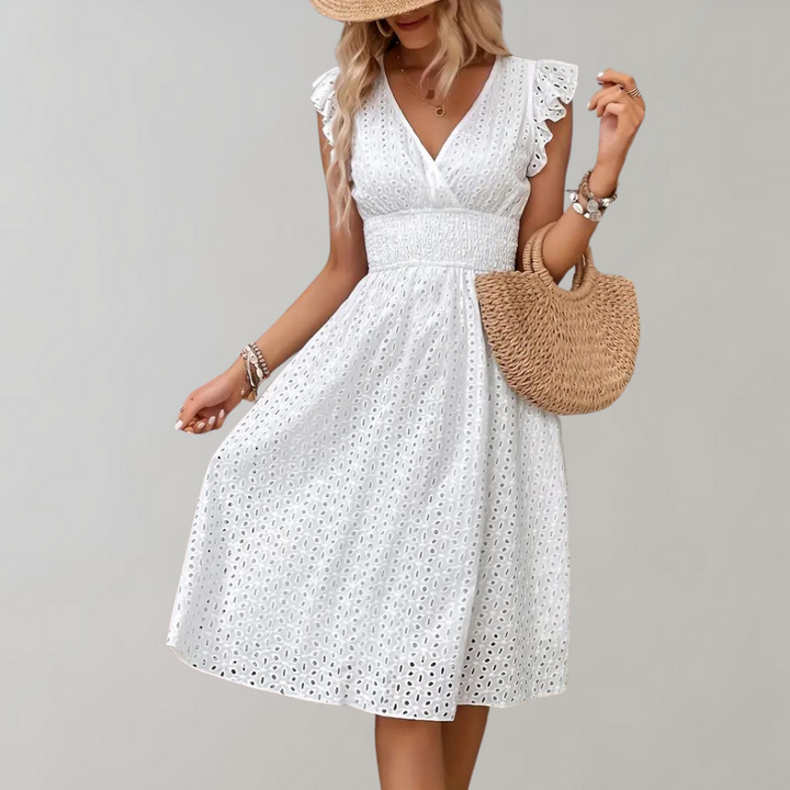 Woman wearing broderie v-neck summer dress