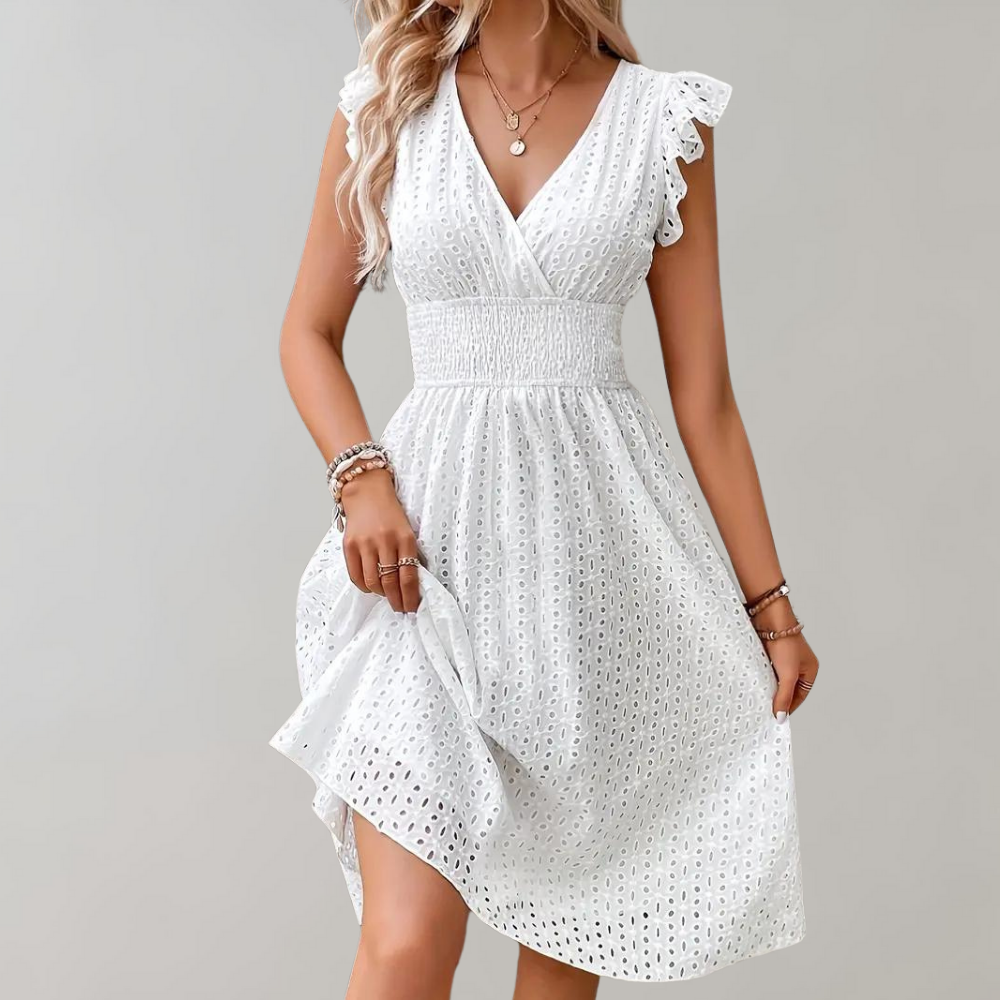 Woman wearing broderie v-neck summer dress