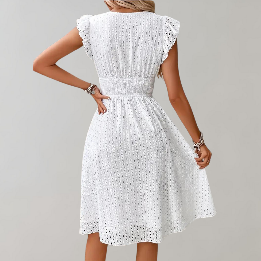 Woman wearing broderie v-neck summer dress