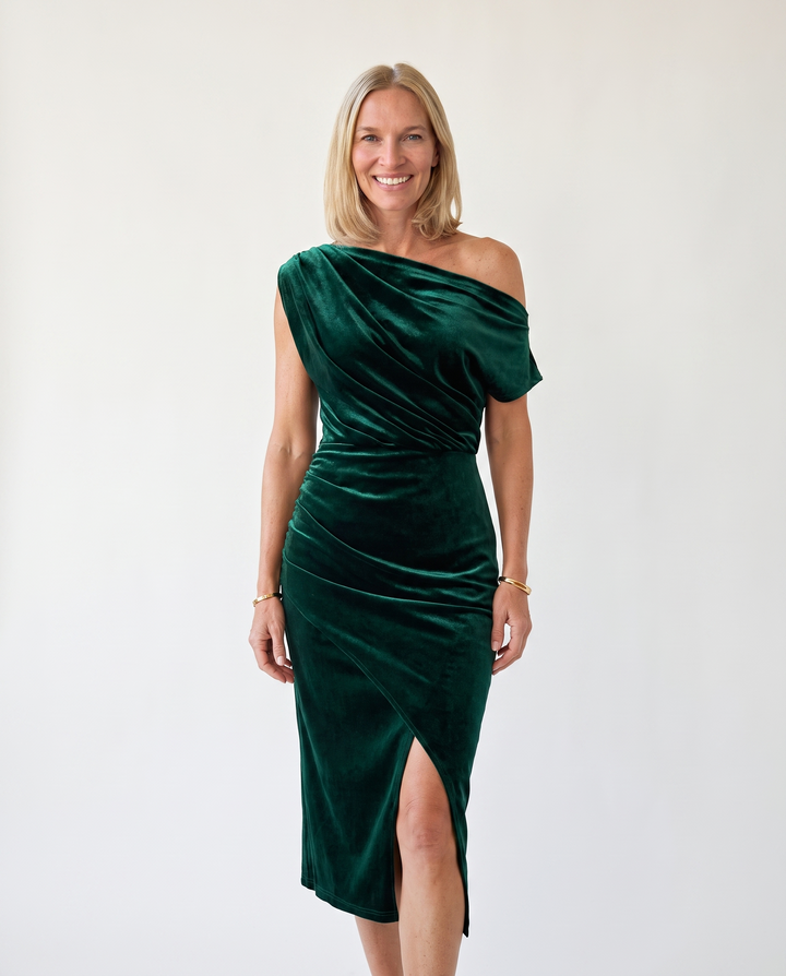 Woman wearing one-shoulder midi dress with luxe velvet finish