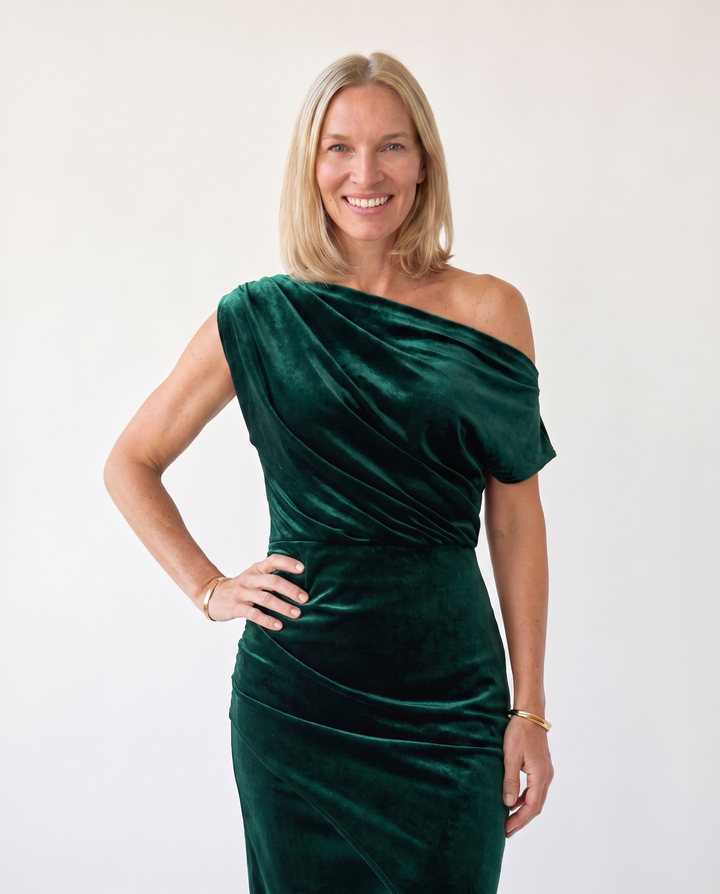 Woman wearing one-shoulder midi dress with luxe velvet finish