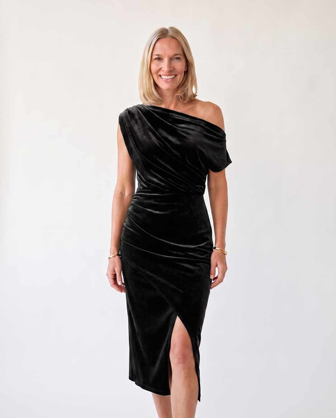 Woman wearing one-shoulder midi dress with luxe velvet finish