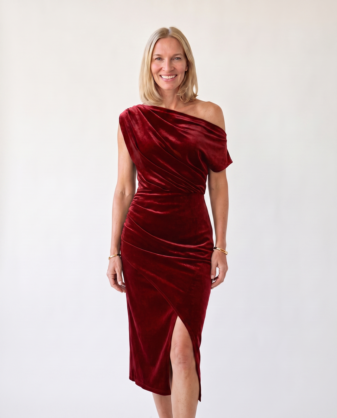 Woman wearing one-shoulder midi dress with luxe velvet finish
