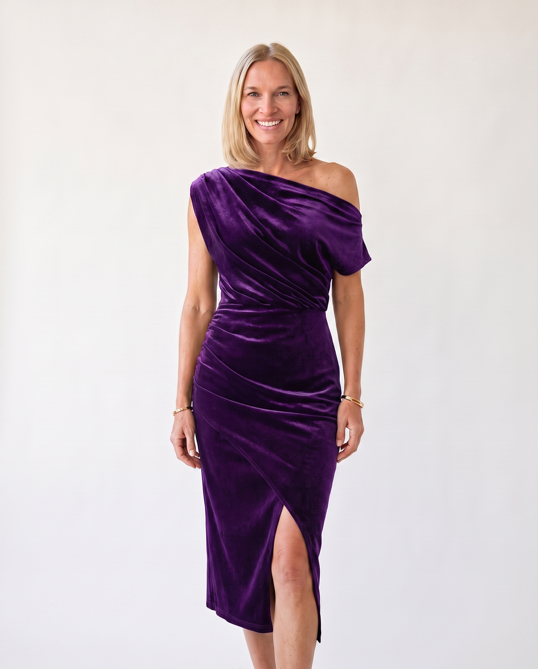 Woman wearing one-shoulder midi dress with luxe velvet finish