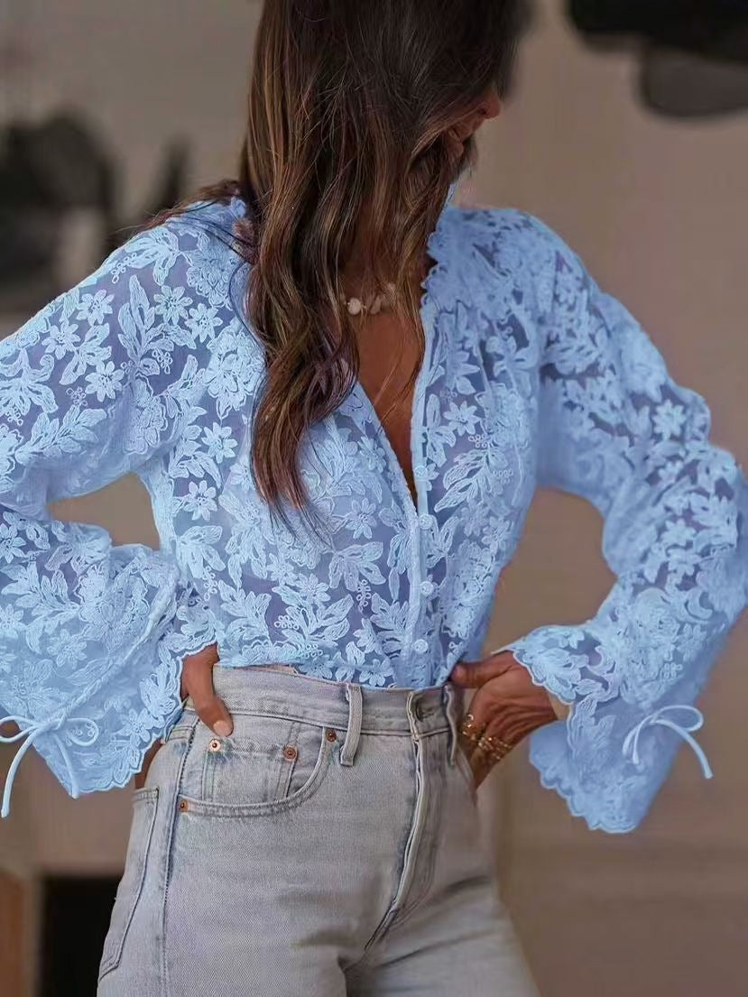 Capucine Thevenot sheer embroidered floral lace button front blouse in blue with balloon sleeves and scalloped tie cuffs
