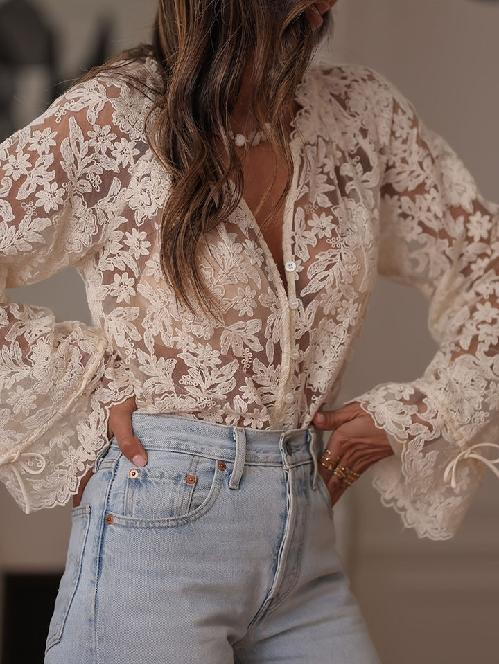 Capucine Thevenot sheer embroidered floral lace button front blouse in cream white with balloon sleeves and scalloped tie cuffs