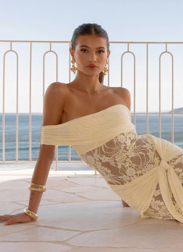 Woman wearing off-shoulder lace maxi dress