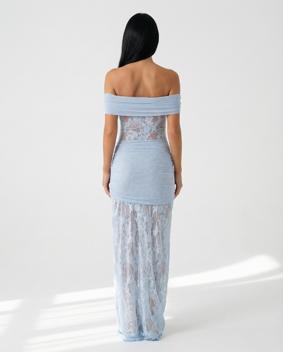 Woman wearing off-shoulder lace maxi dress