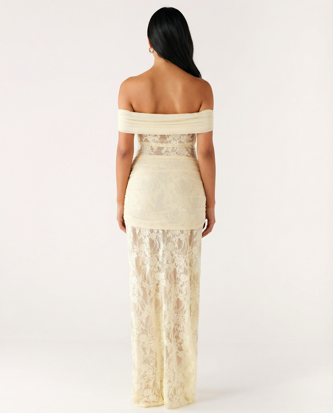 Woman wearing off-shoulder lace maxi dress