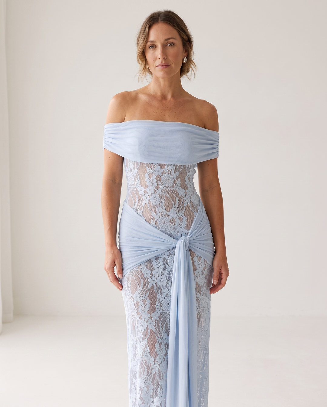 Woman wearing off-shoulder lace maxi dress