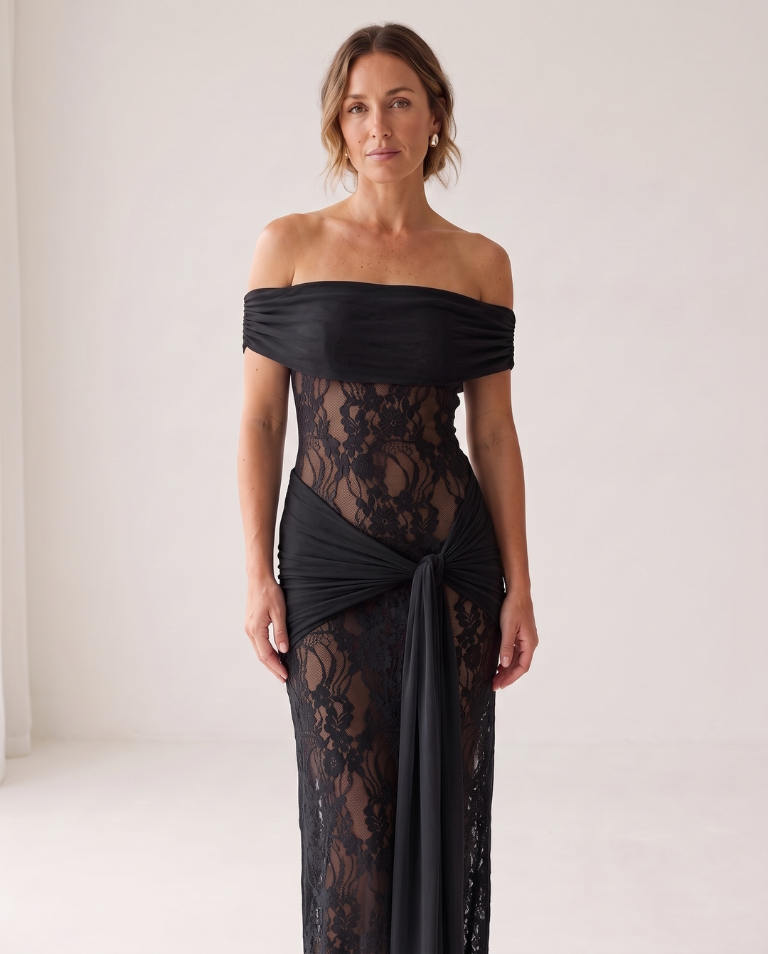 Woman wearing off-shoulder lace maxi dress