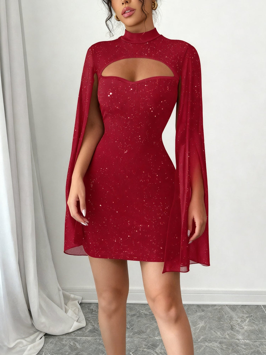 Coralie Marsollier glitter mini dress with sheer cape sleeves, keyhole cutout and high mock neck