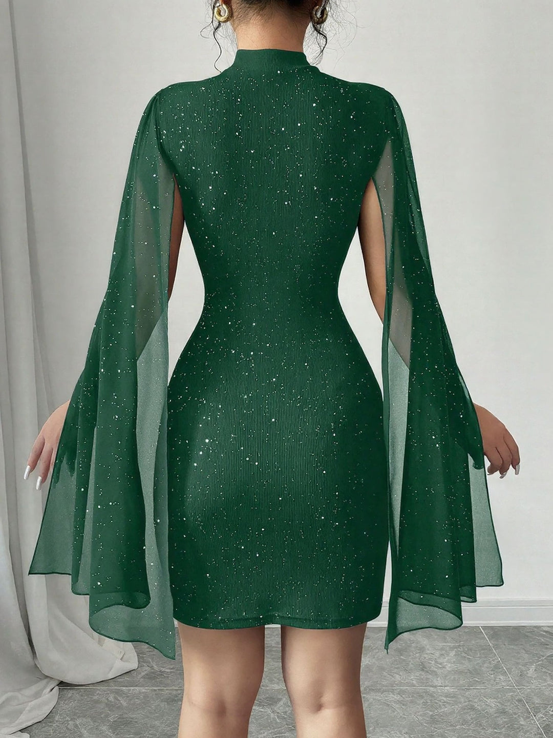Coralie Marsollier glitter mini dress with sheer cape sleeves, keyhole cutout and high mock neck
