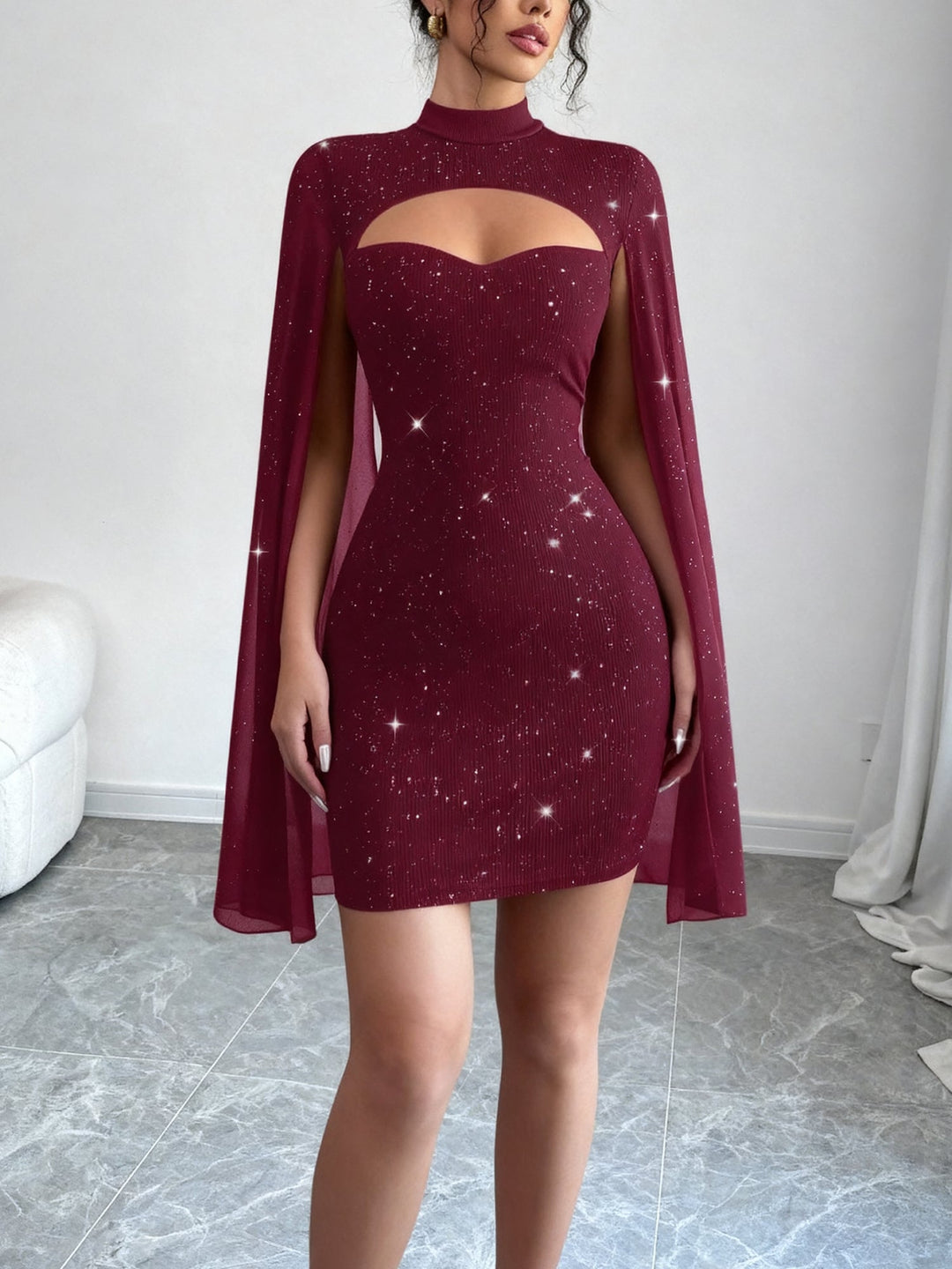 Coralie Marsollier glitter mini dress with sheer cape sleeves, keyhole cutout and high mock neck