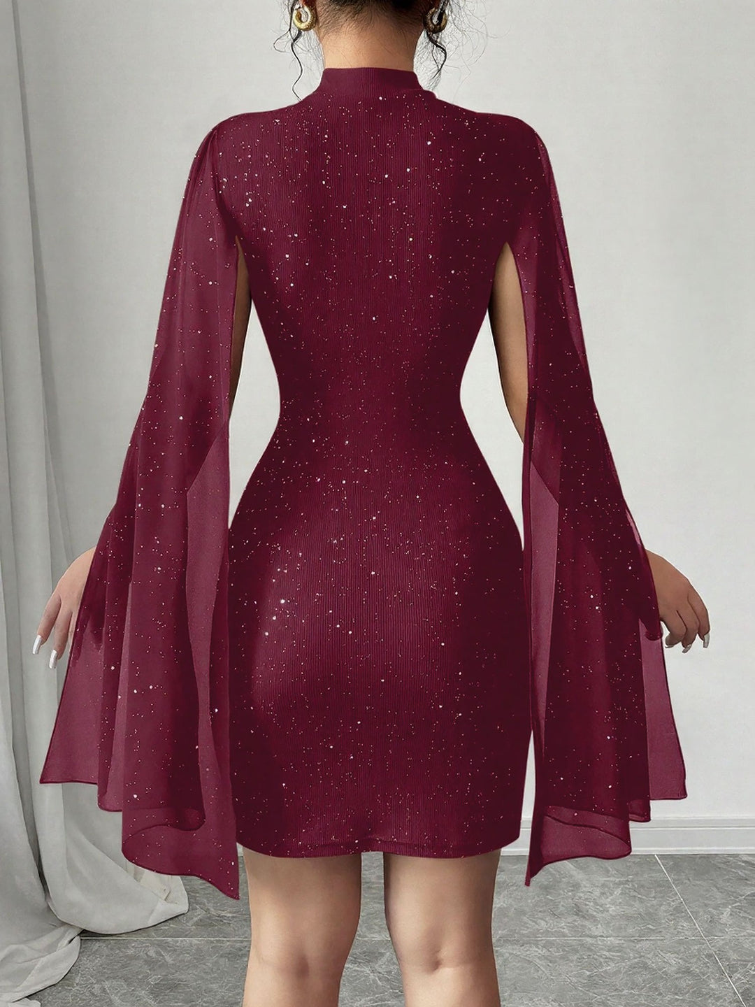 Coralie Marsollier glitter mini dress with sheer cape sleeves, keyhole cutout and high mock neck