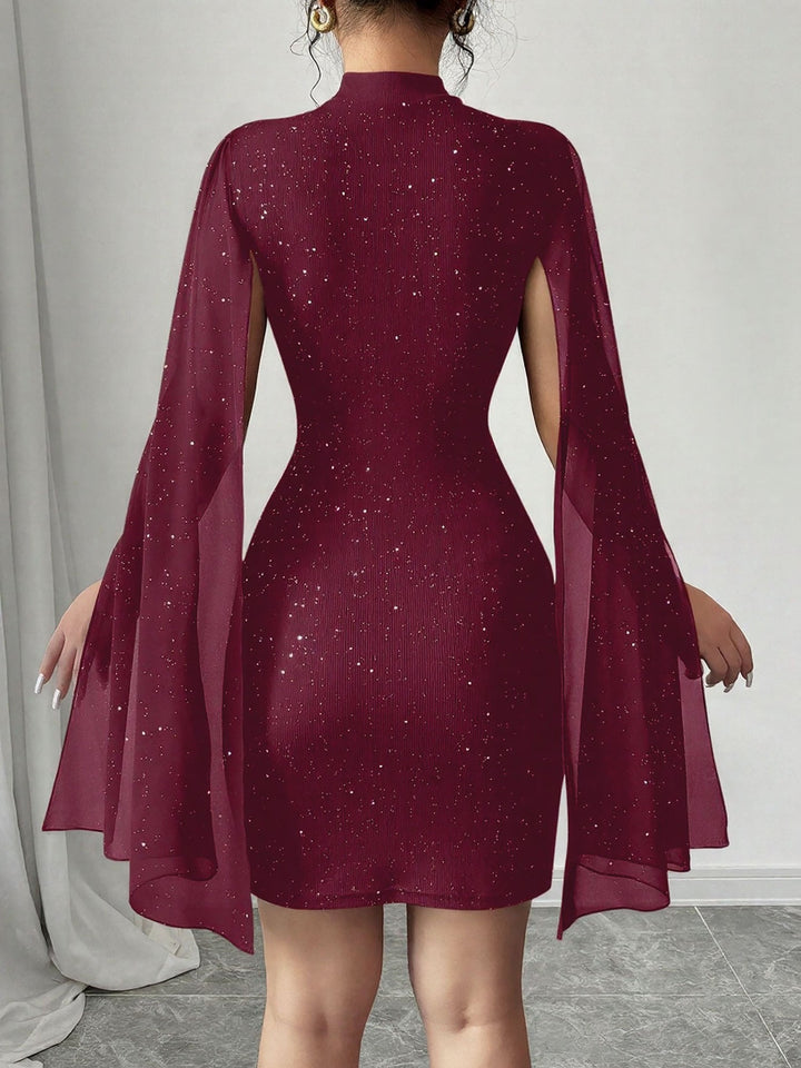 Coralie Marsollier glitter mini dress with sheer cape sleeves, keyhole cutout and high mock neck