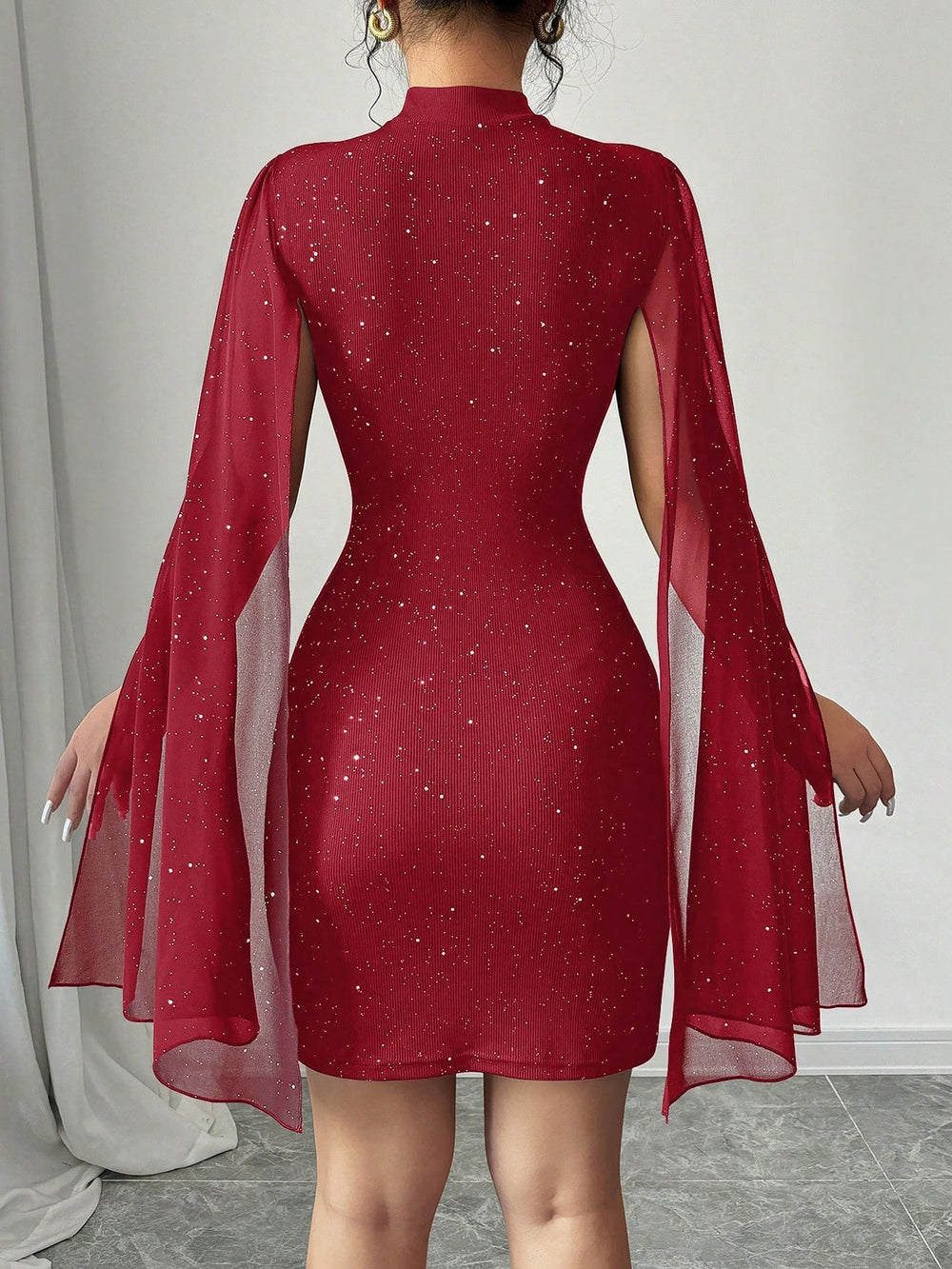 Coralie Marsollier glitter mini dress with sheer cape sleeves, keyhole cutout and high mock neck