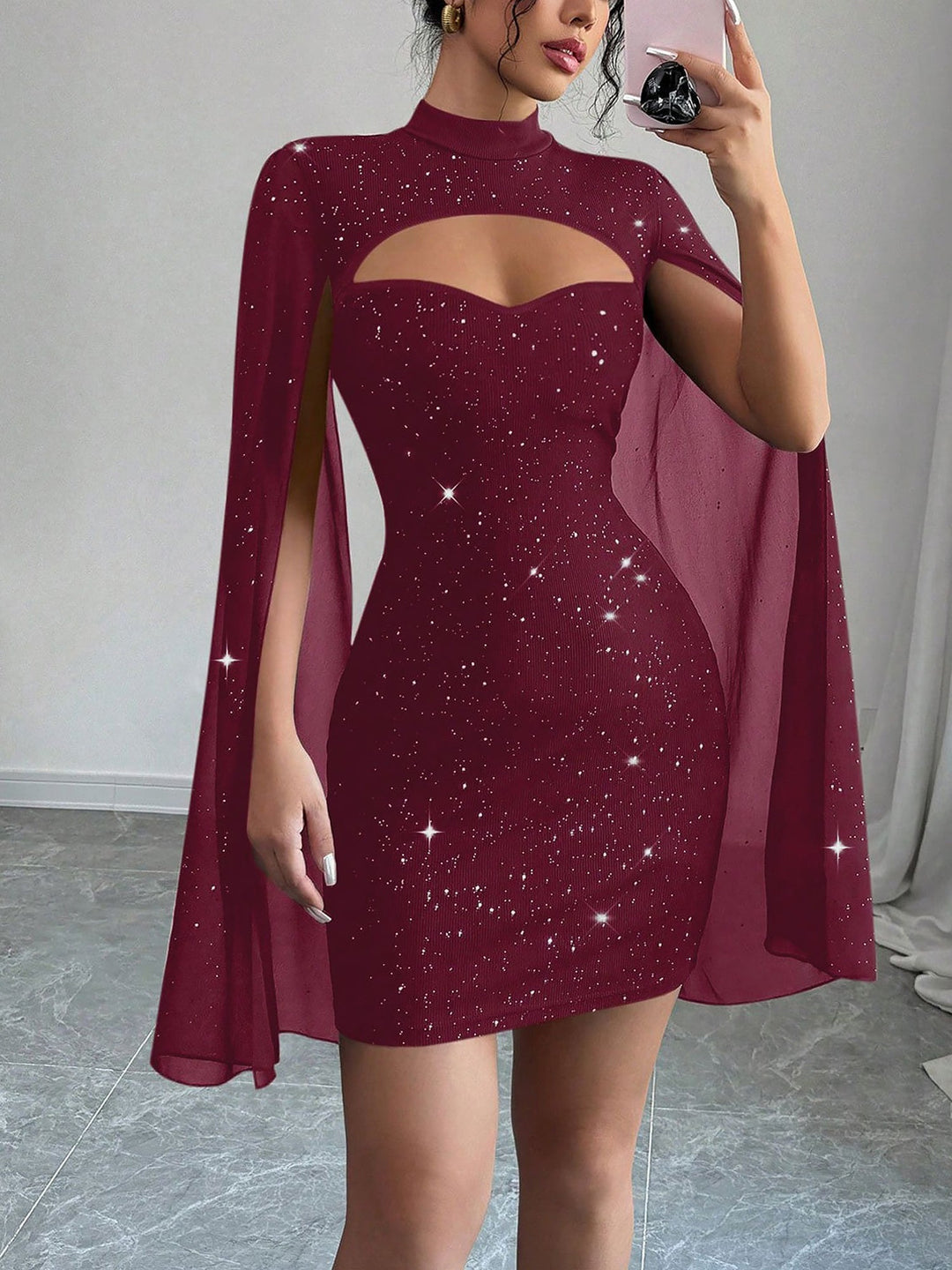 Coralie Marsollier glitter mini dress with sheer cape sleeves, keyhole cutout and high mock neck