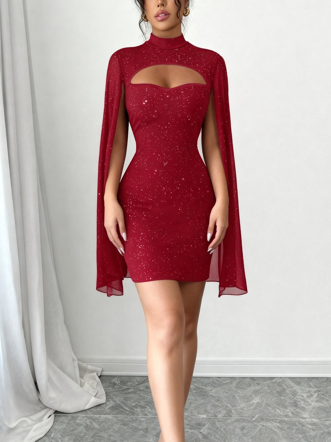 Coralie Marsollier glitter mini dress with sheer cape sleeves, keyhole cutout and high mock neck