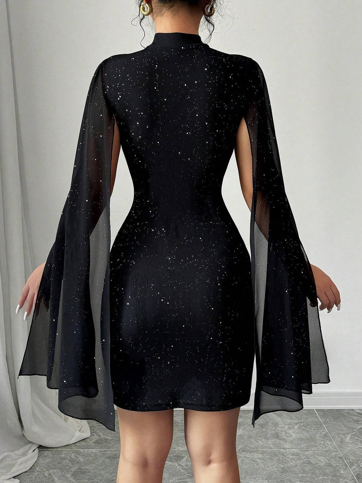 Coralie Marsollier glitter mini dress with sheer cape sleeves, keyhole cutout and high mock neck