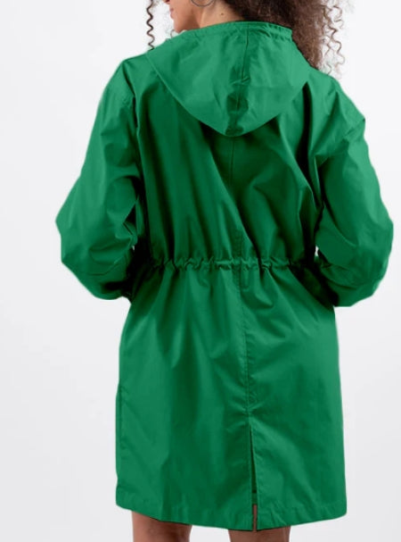 Woman wearing long hooded rain jacket