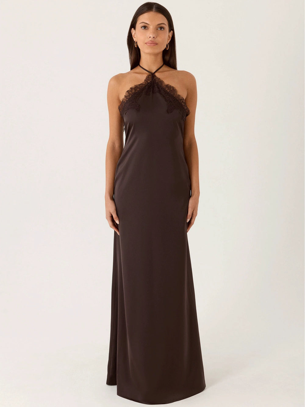 Woman wearing lace halter maxi dress