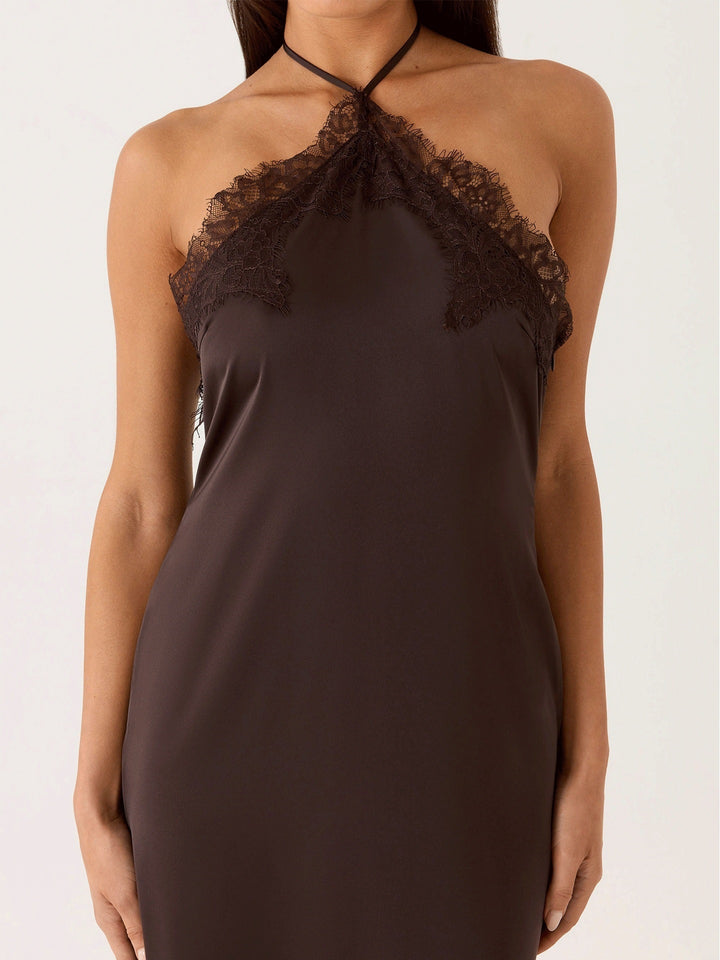 Woman wearing lace halter maxi dress