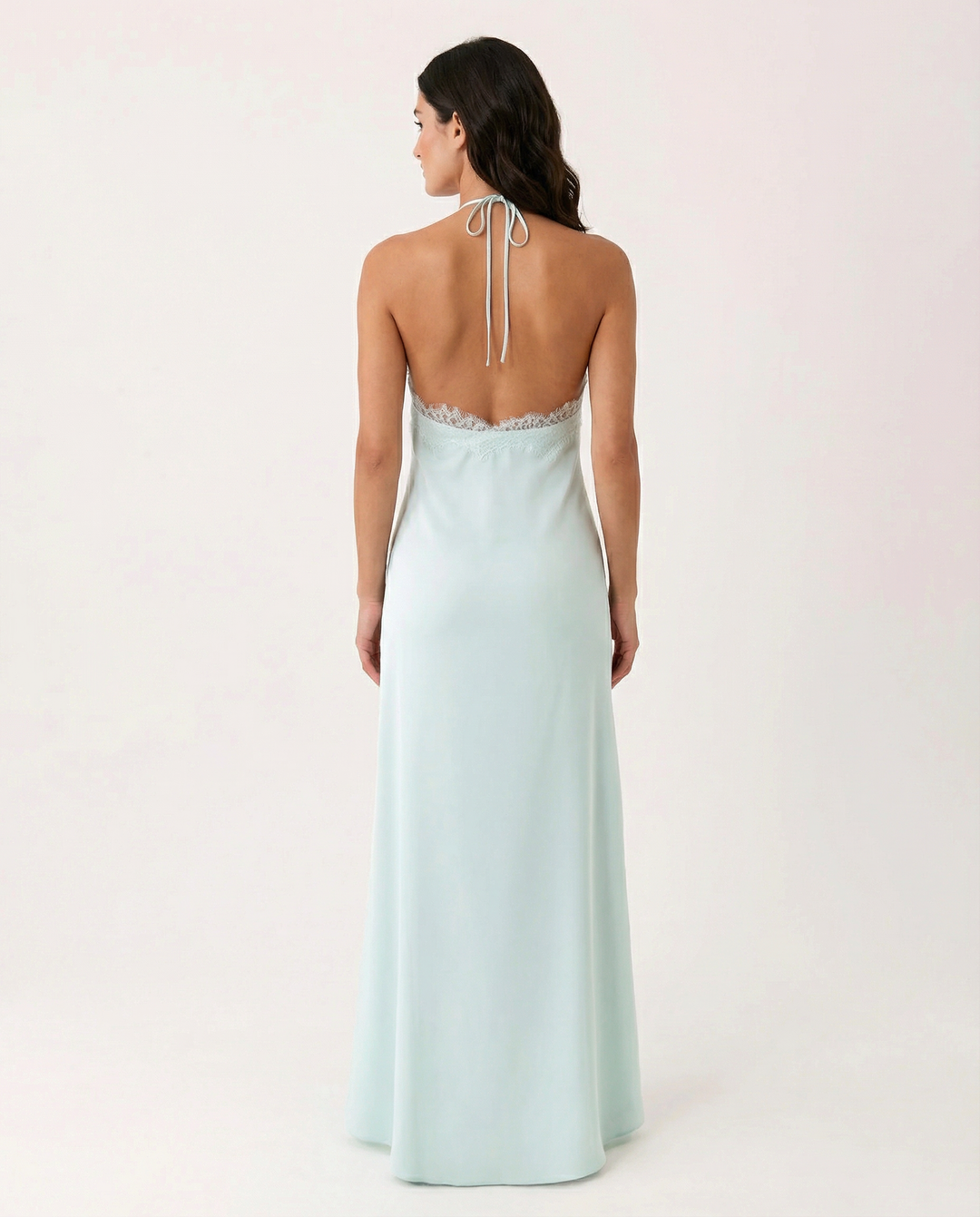 Woman wearing lace halter maxi dress