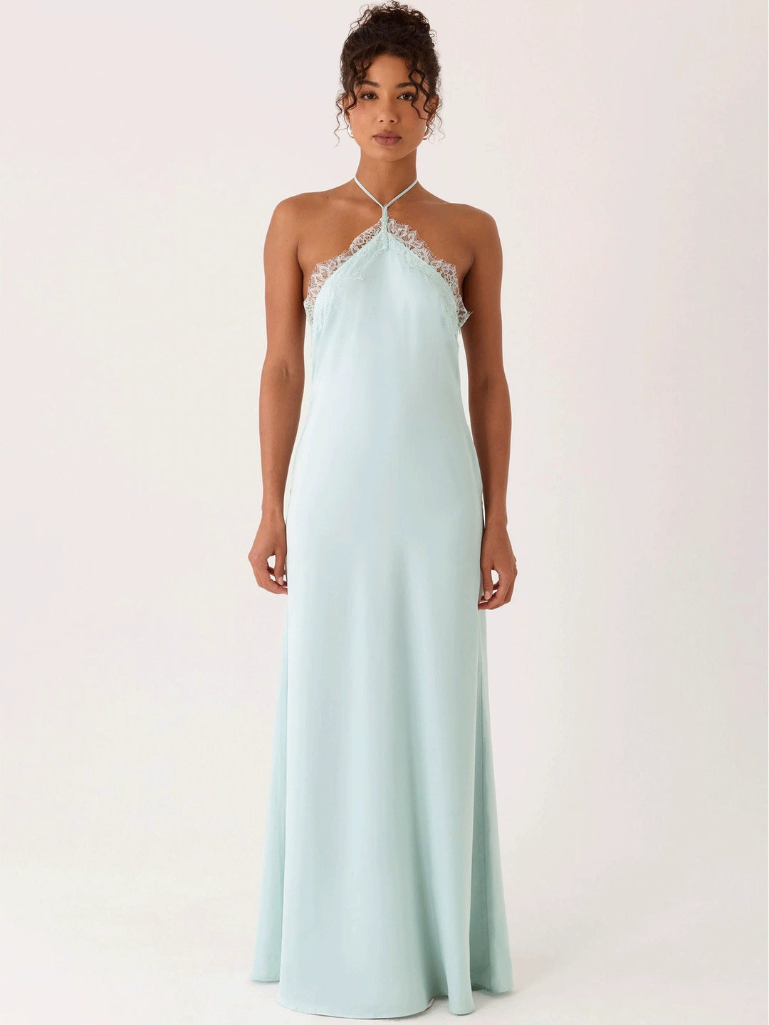Woman wearing lace halter maxi dress