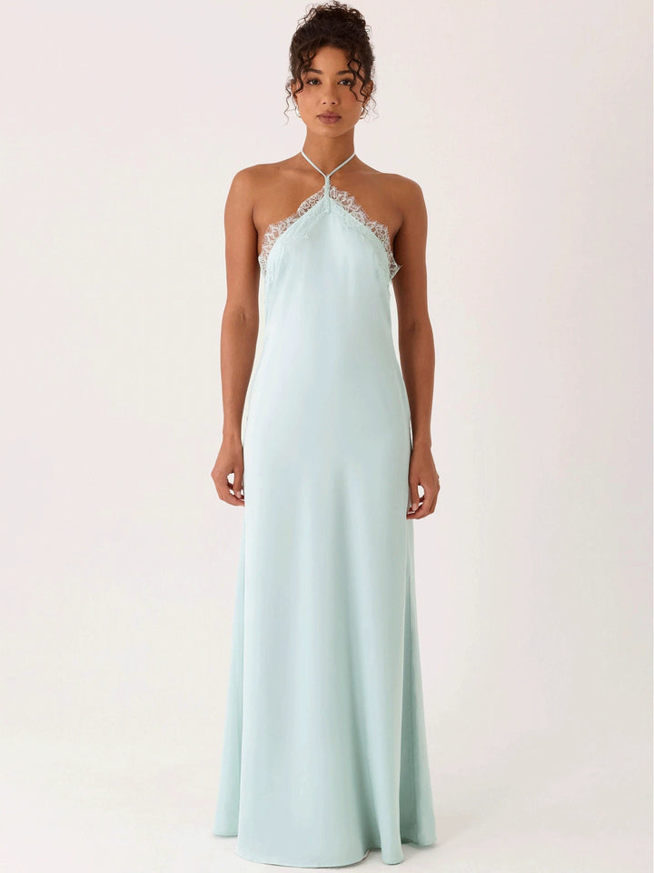 Woman wearing lace halter maxi dress