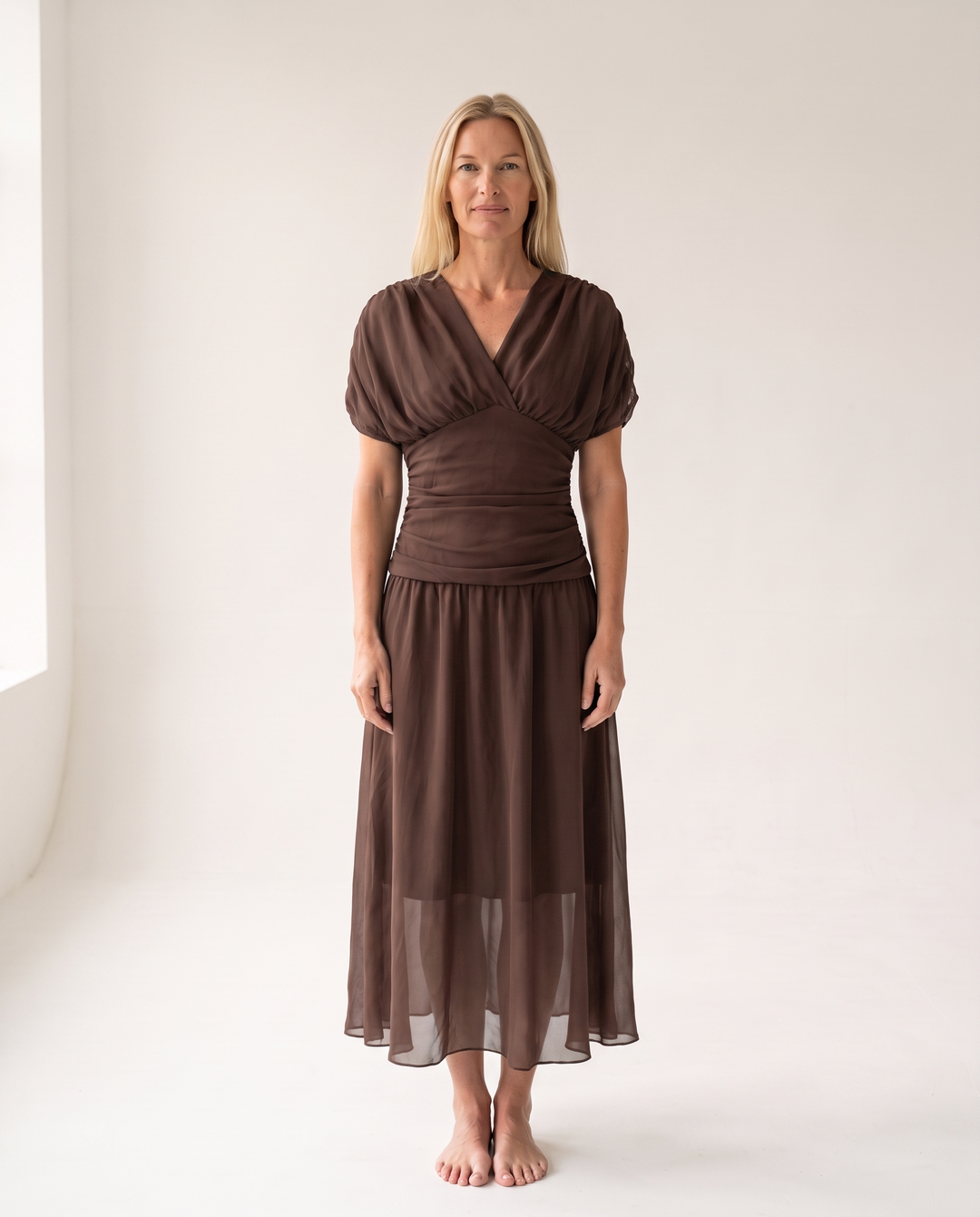 Woman wearing off shoulder maxi dress