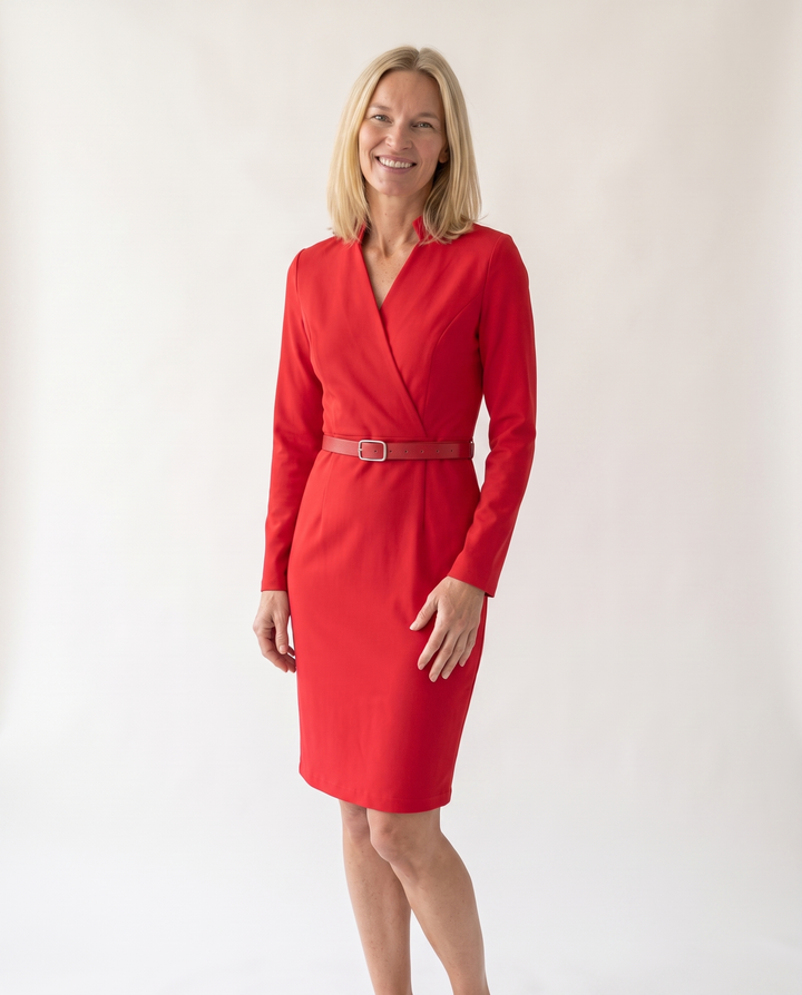 Woman wearing elegant belted midi dress