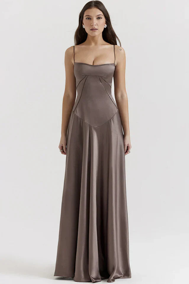Woman wearing elegant satin maxi dress