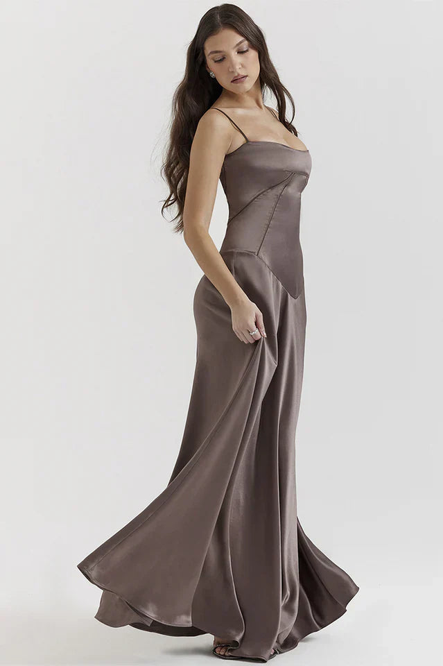 Woman wearing elegant satin maxi dress