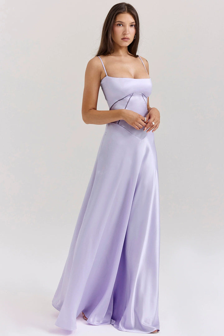 Woman wearing elegant satin maxi dress