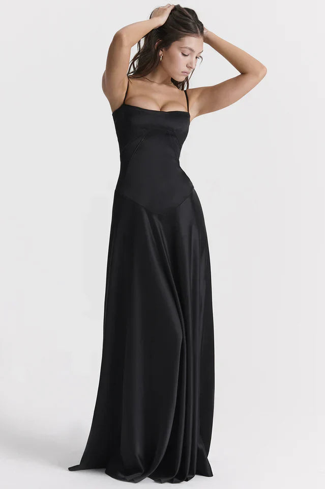 Woman wearing elegant satin maxi dress