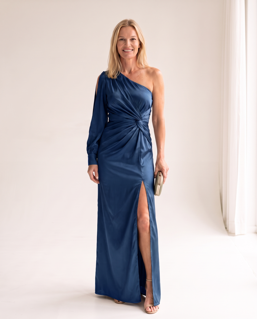 Woman wearing one shoulder satin evening dress