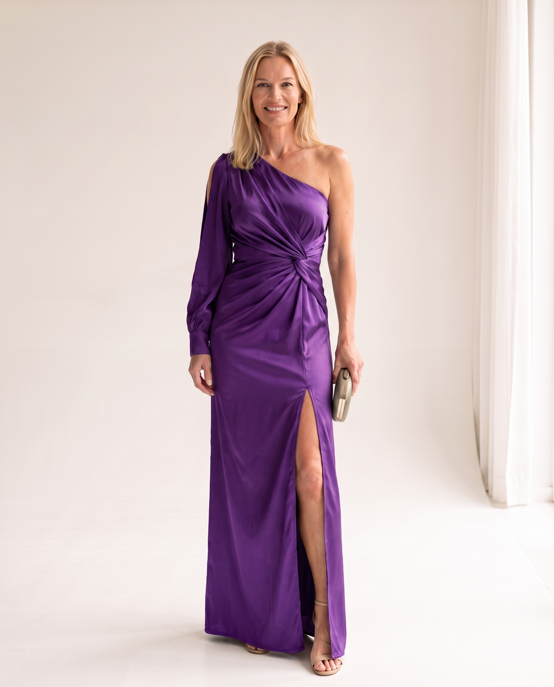 Woman wearing one shoulder satin evening dress