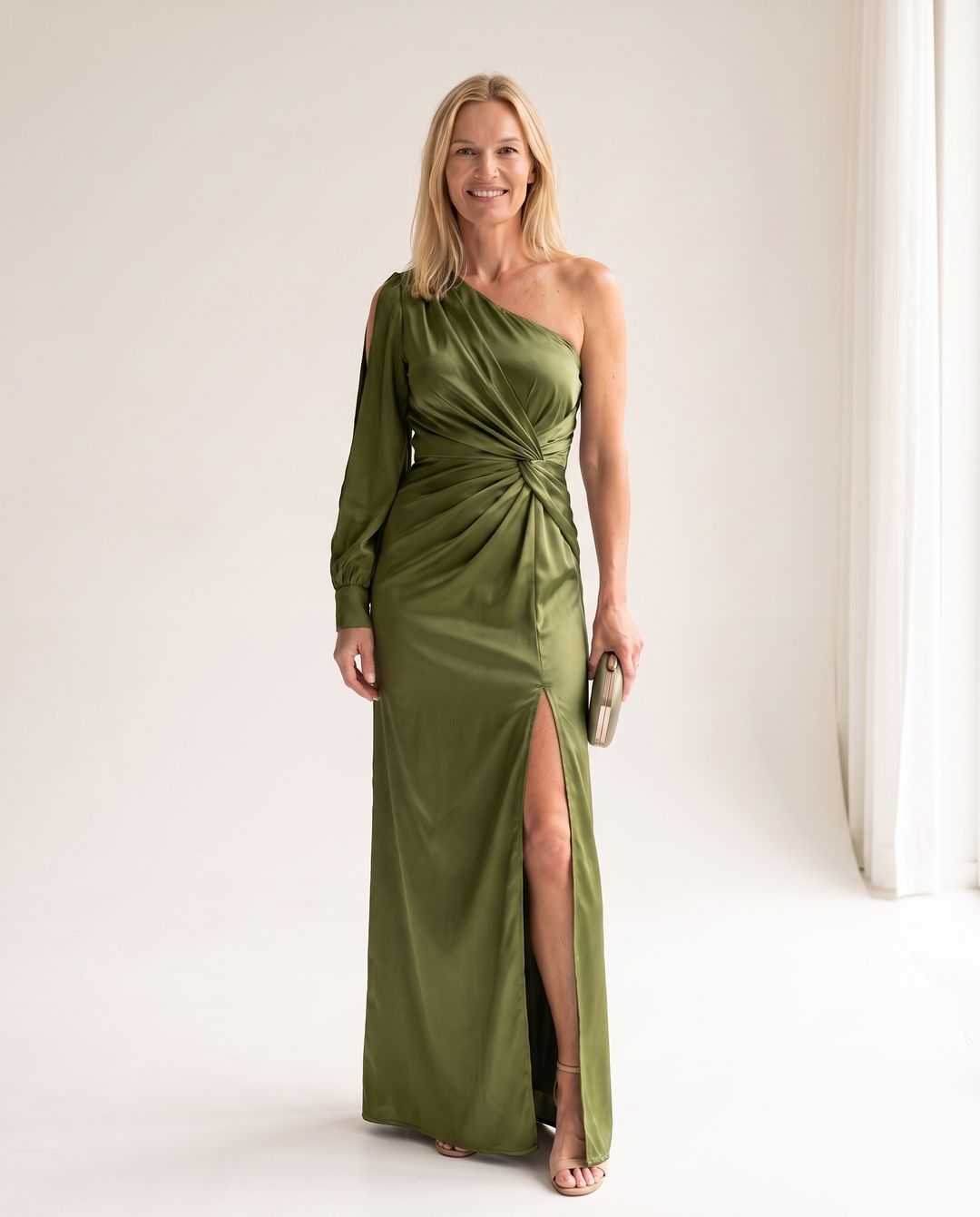 Woman wearing one shoulder satin evening dress