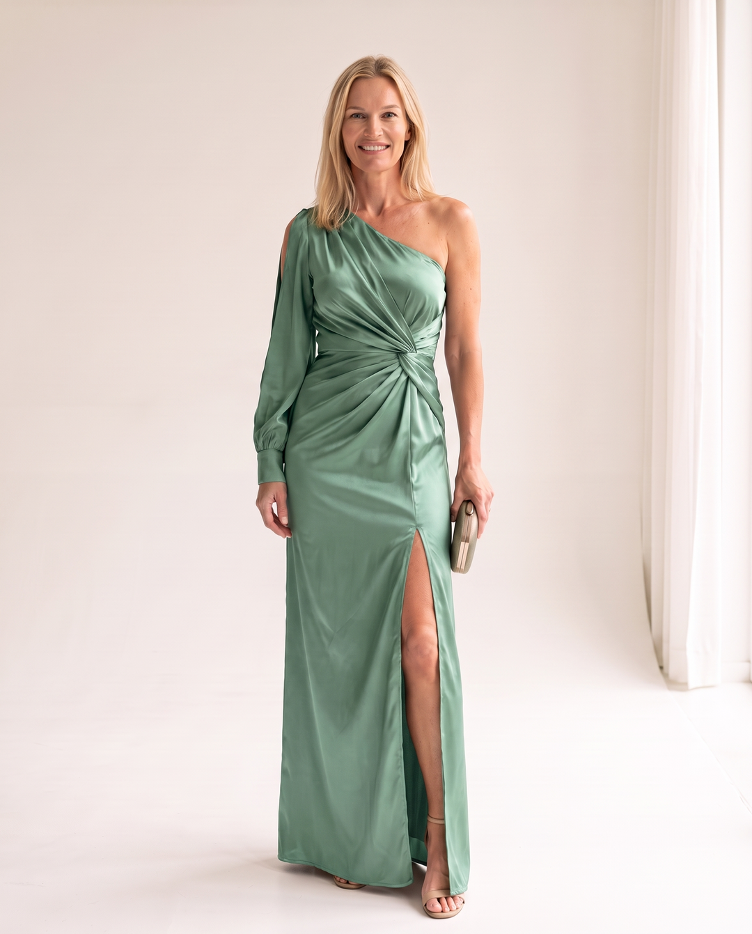 Woman wearing one shoulder satin evening dress
