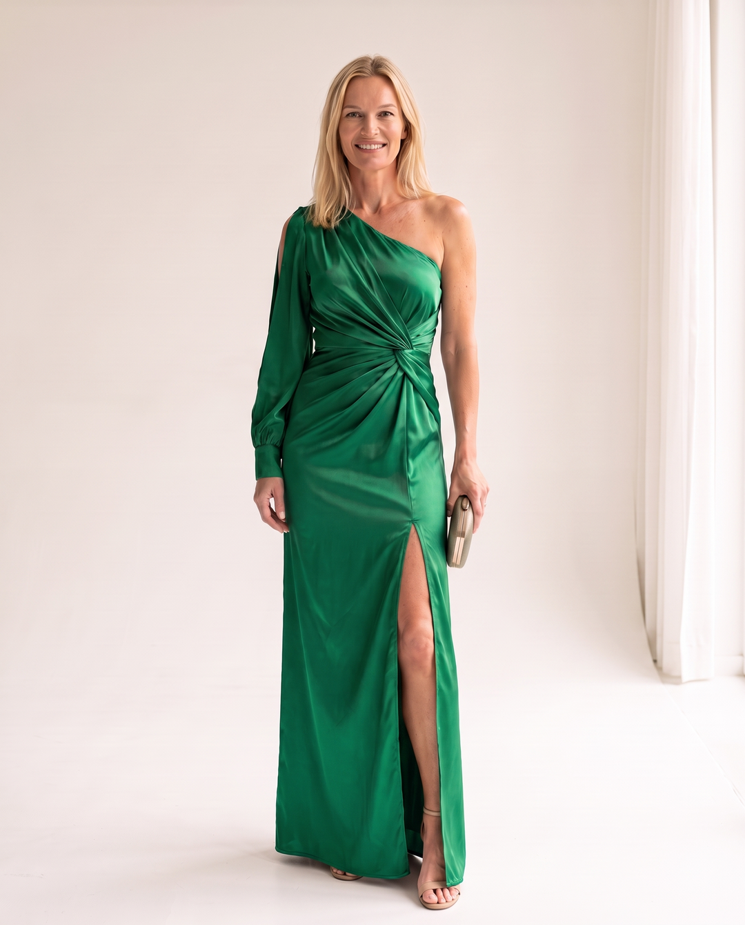 Woman wearing one shoulder satin evening dress