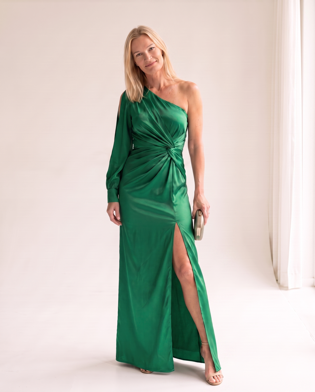 Woman wearing one shoulder satin evening dress
