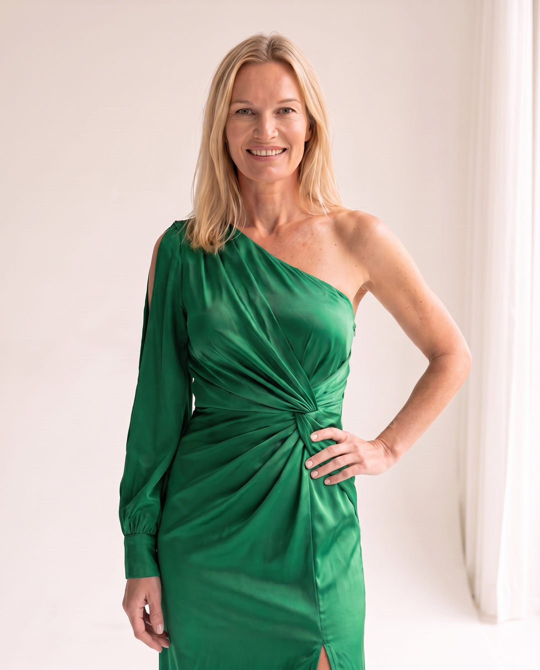 Woman wearing one shoulder satin evening dress